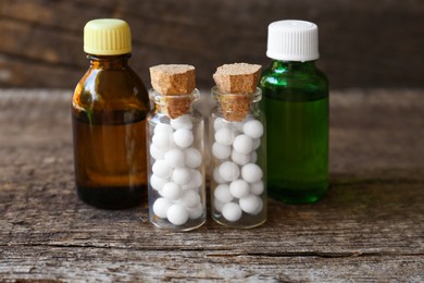 Photo of Bottles with homeopathic remedy on wooden stump