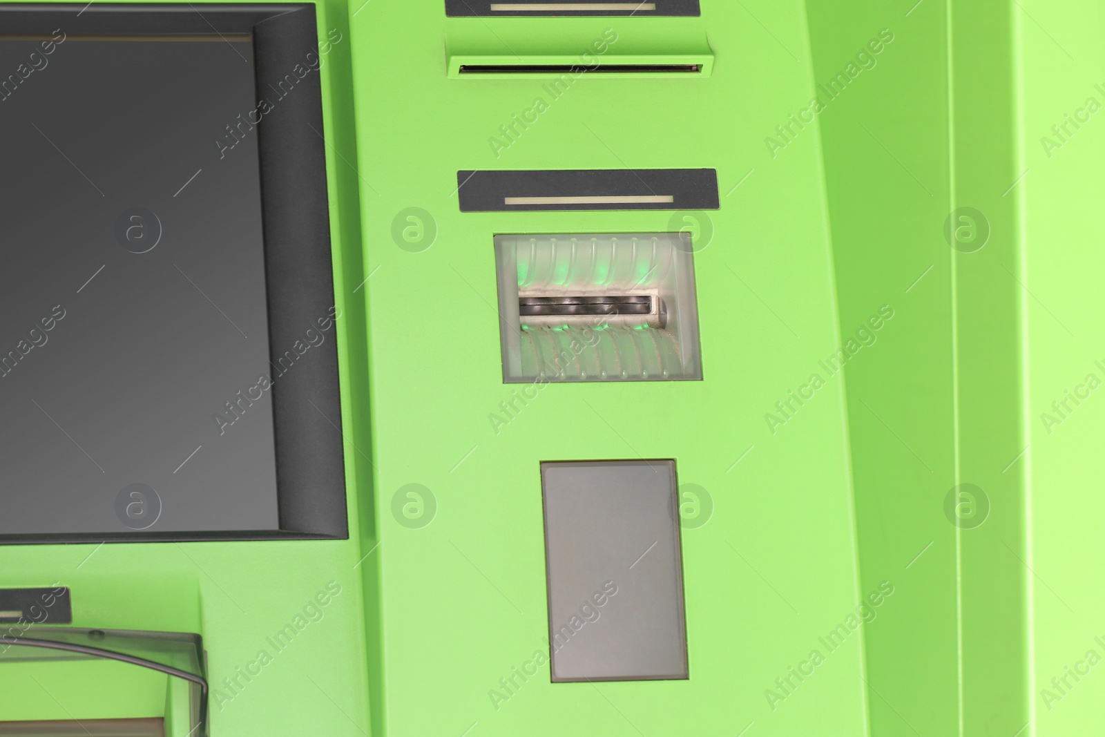 Photo of Modern automated cash machine with screen outdoors