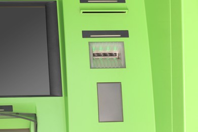 Modern automated cash machine with screen outdoors