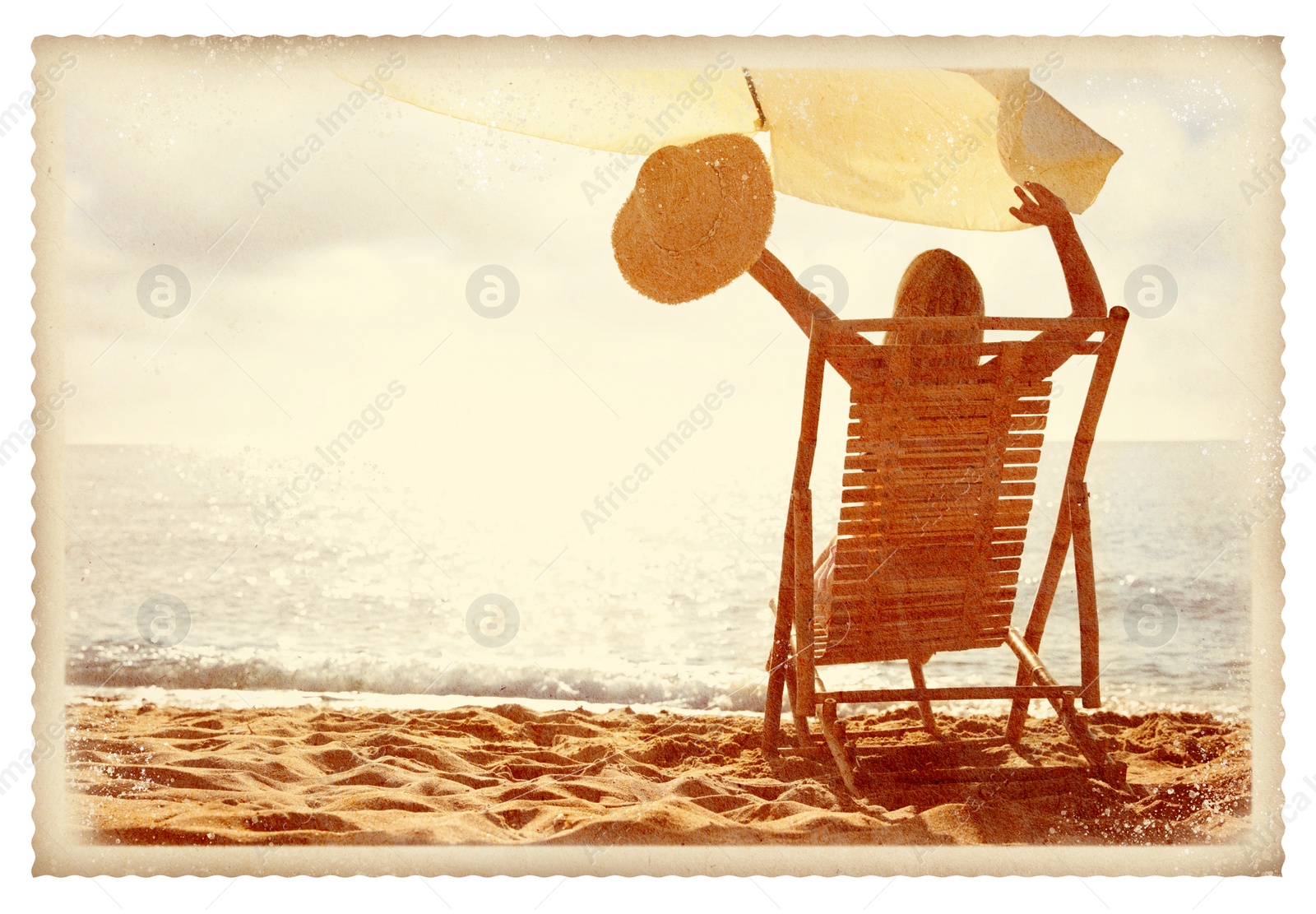 Image of Old paper photo. Woman relaxing on deck chair at sandy beach 