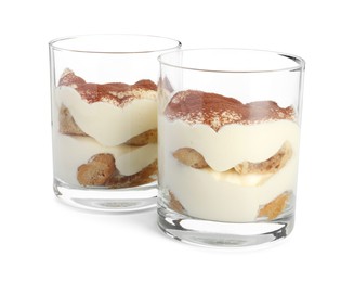 Photo of Delicious tiramisu in glasses isolated on white