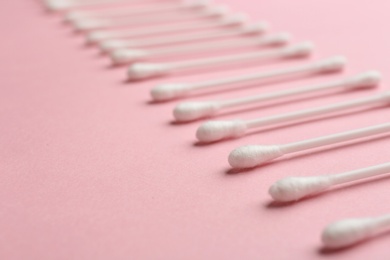 Photo of Composition with cotton swabs and space for text on color background