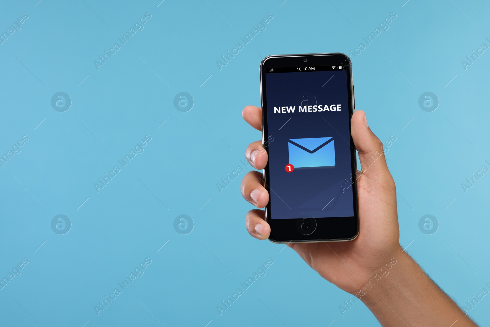 Image of Got new message. Man holding smartphone on light blue background, closeup. Space for text