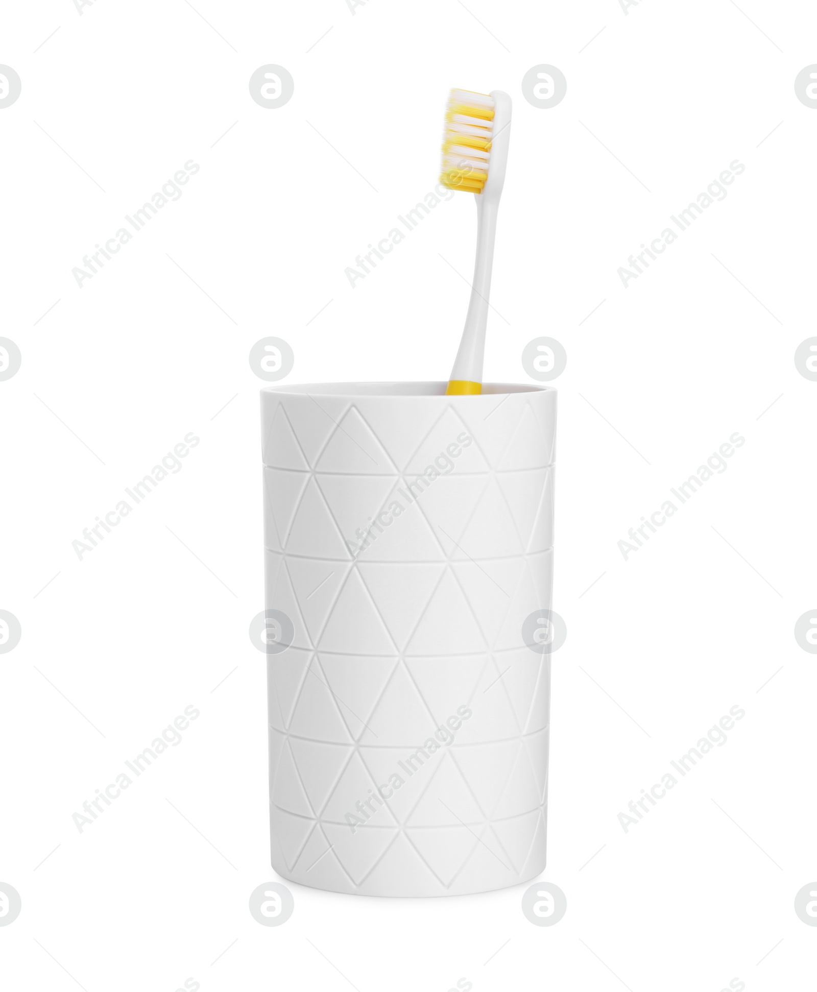 Photo of One plastic toothbrush in holder isolated on white