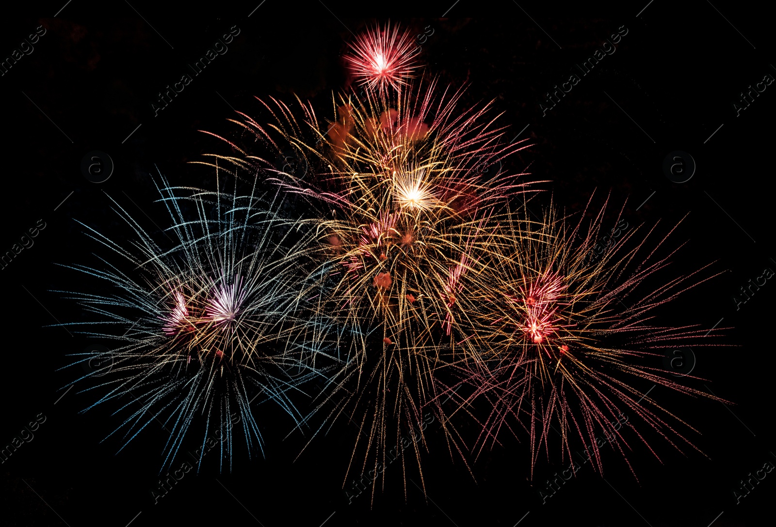 Image of Beautiful bright fireworks lighting up night sky