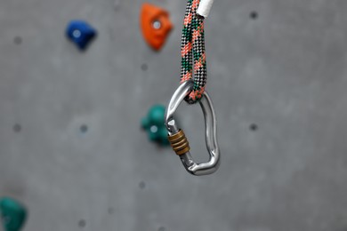 Wall with holds  in gym, focus on climbing equipment, closeup