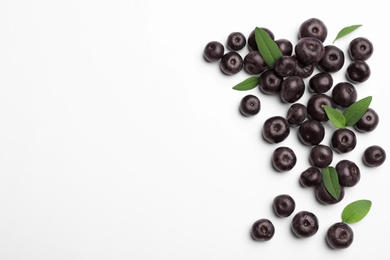 Photo of Fresh acai berries on white background, top view