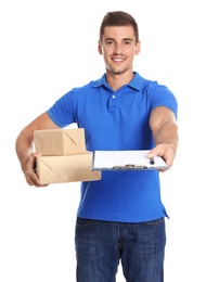 Happy young courier with parcels and clipboard on white background