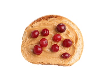 Slice of bread with peanut butter and cranberries on white background, top view