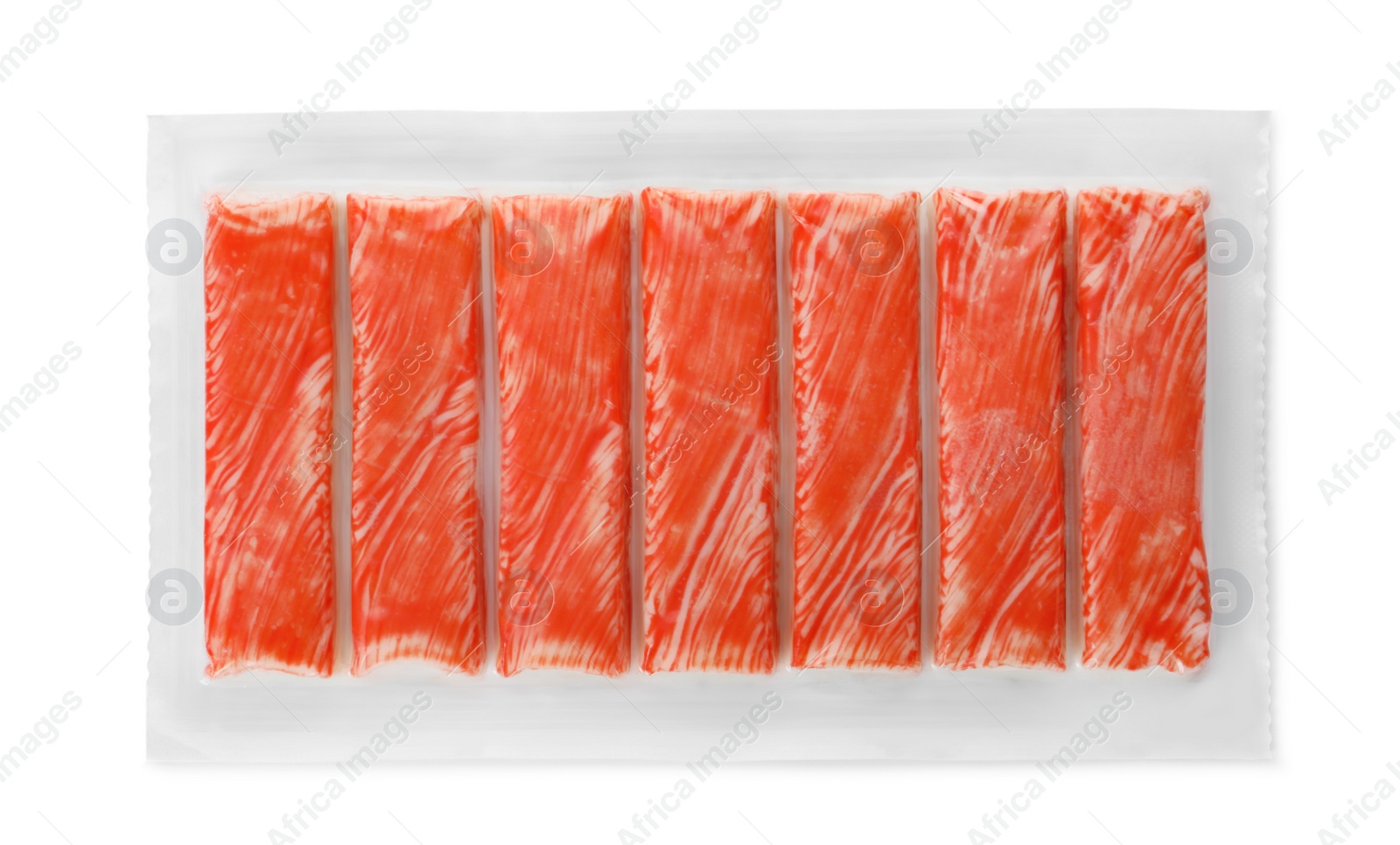 Photo of Pack of fresh crab sticks isolated on white, top view