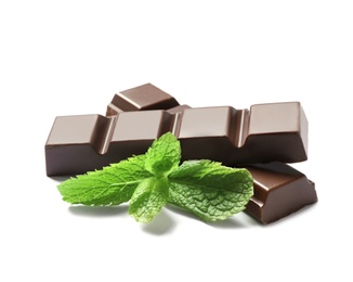 Pieces of dark chocolate with mint on white background