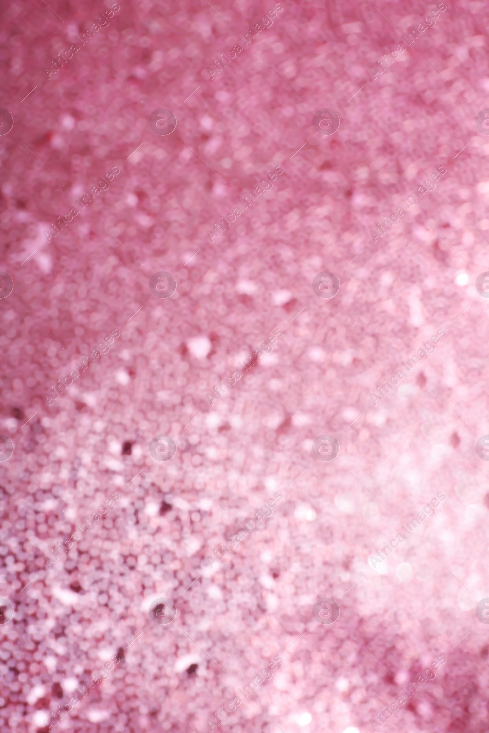 Photo of Blurred view of shiny rose gold surface as background