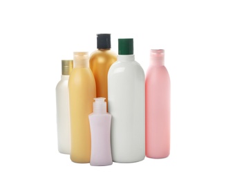 Photo of Bottles with cosmetic products on white background. Mockup for design