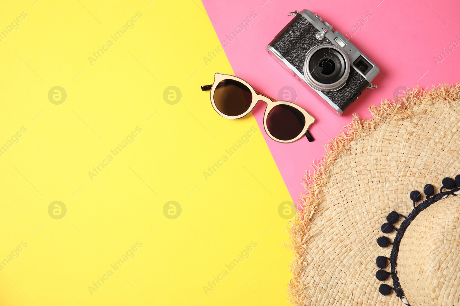 Photo of Flat lay composition with summer accessories, camera and space for text on color background. Travel blogger