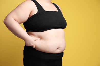 Photo of Overweight woman on color background