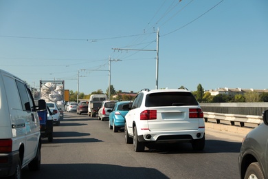 Modern cars in traffic jam on bridge