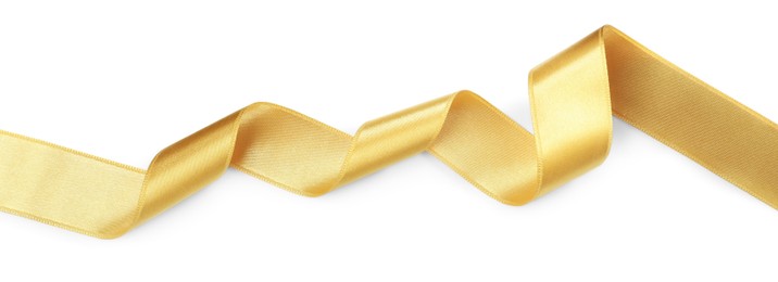 Photo of Beautiful golden ribbon isolated on white, top view