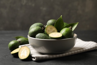 Fresh green feijoa fruits on black table, closeup