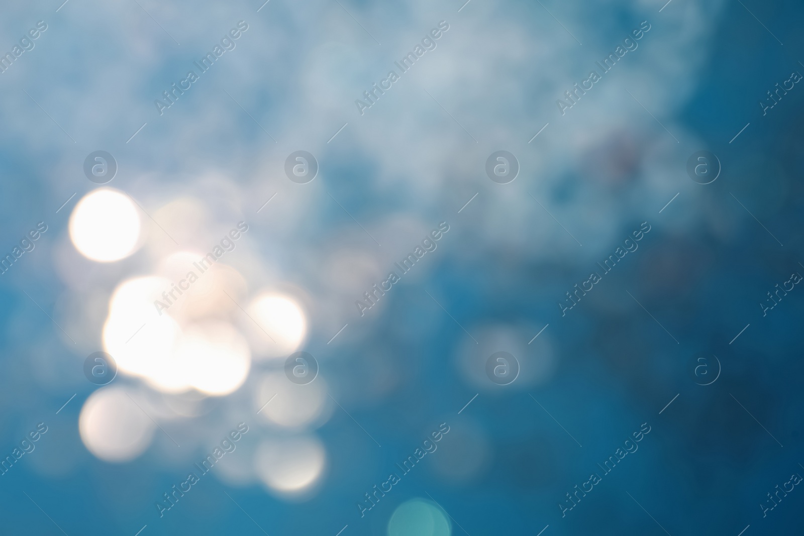 Photo of Shiny blue background with magical bokeh effect