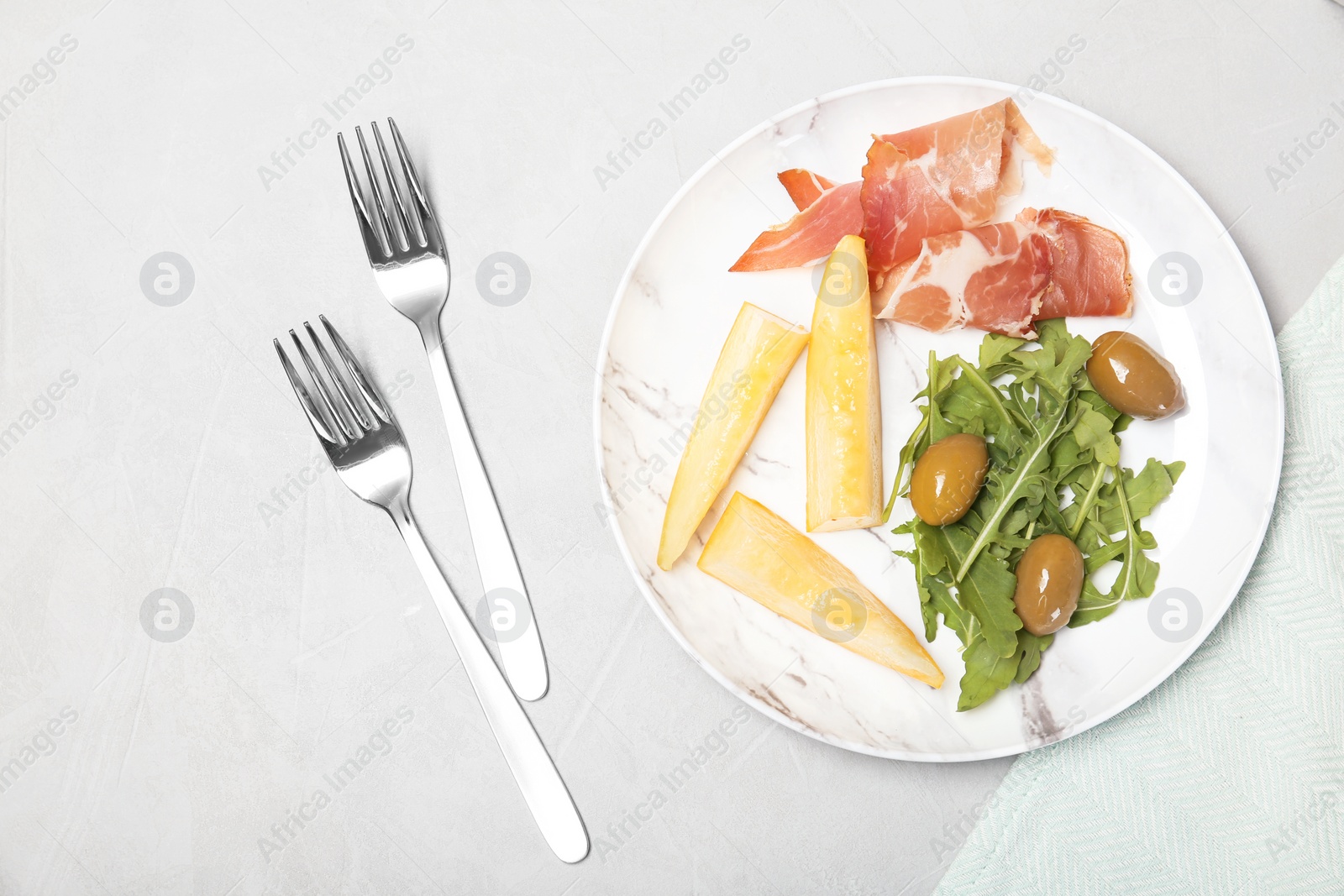 Photo of Flat lay composition with served melon appetizer served on table