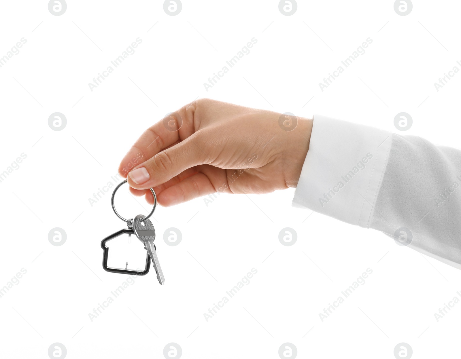 Photo of Real estate agent holding house key with trinket on white background, closeup