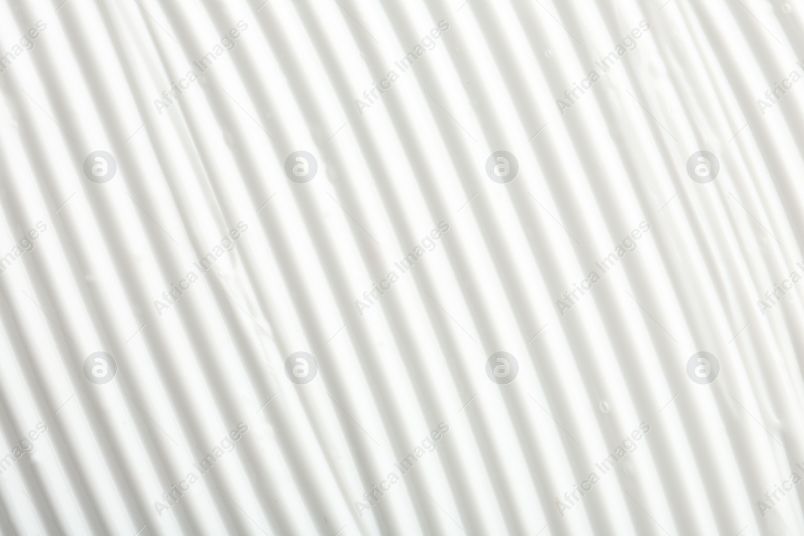 Photo of Texture of face care cream as background, top view