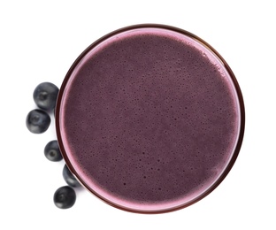 Photo of Glass of acai drink with berries on white background, top view