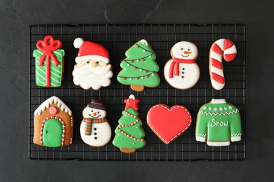 Delicious Christmas cookies on black table, top view