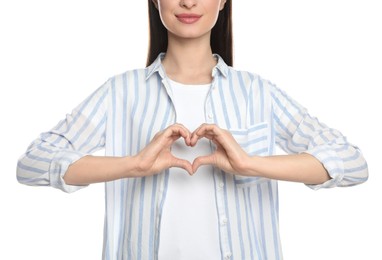 Photo of Happy woman showing heart on white background, closeup