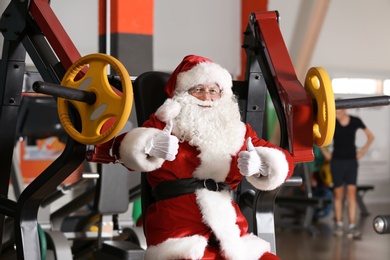Photo of Happy Authentic Santa Claus in modern gym