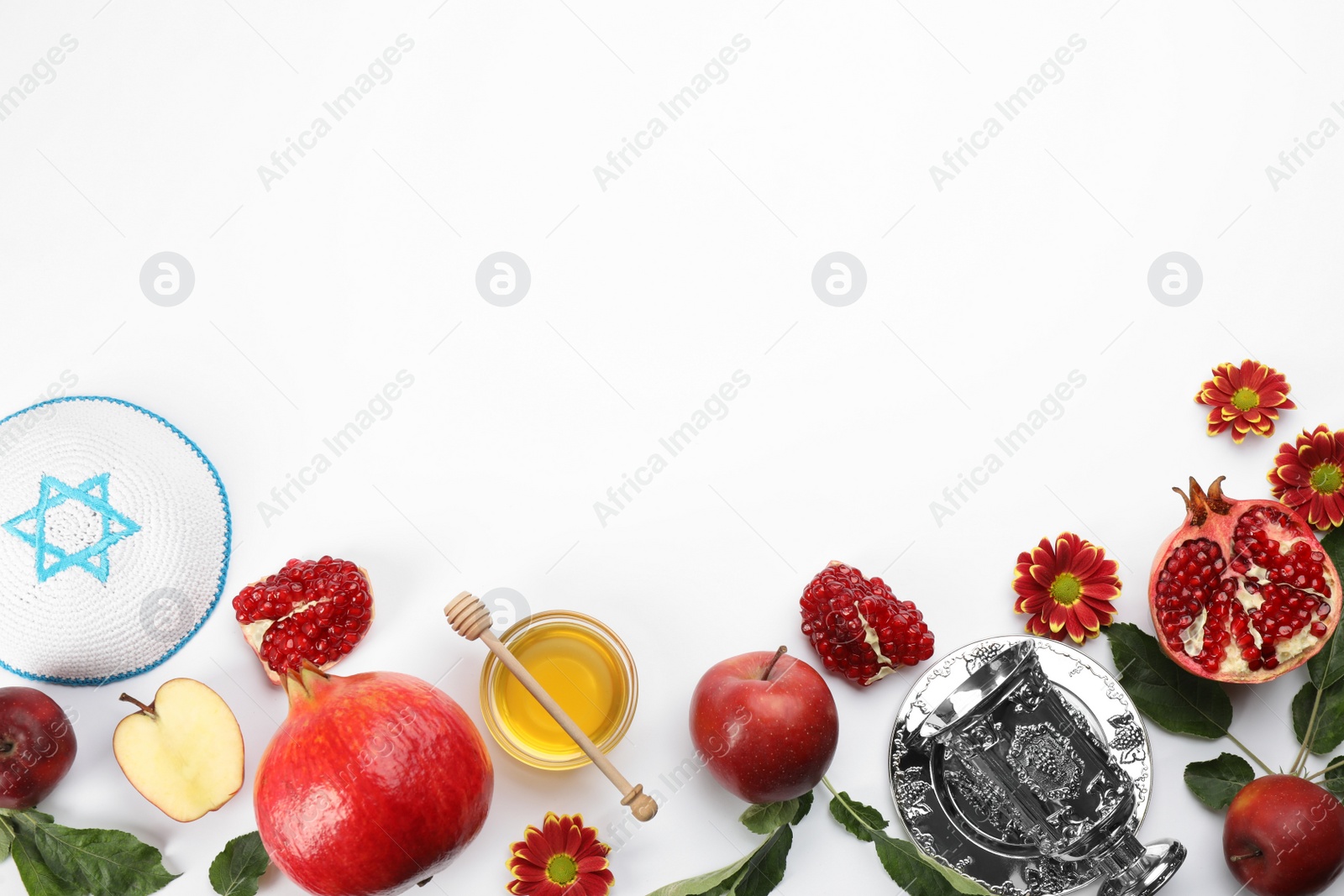 Photo of Flat lay composition with Rosh Hashanah holiday attributes on white background. Space for text