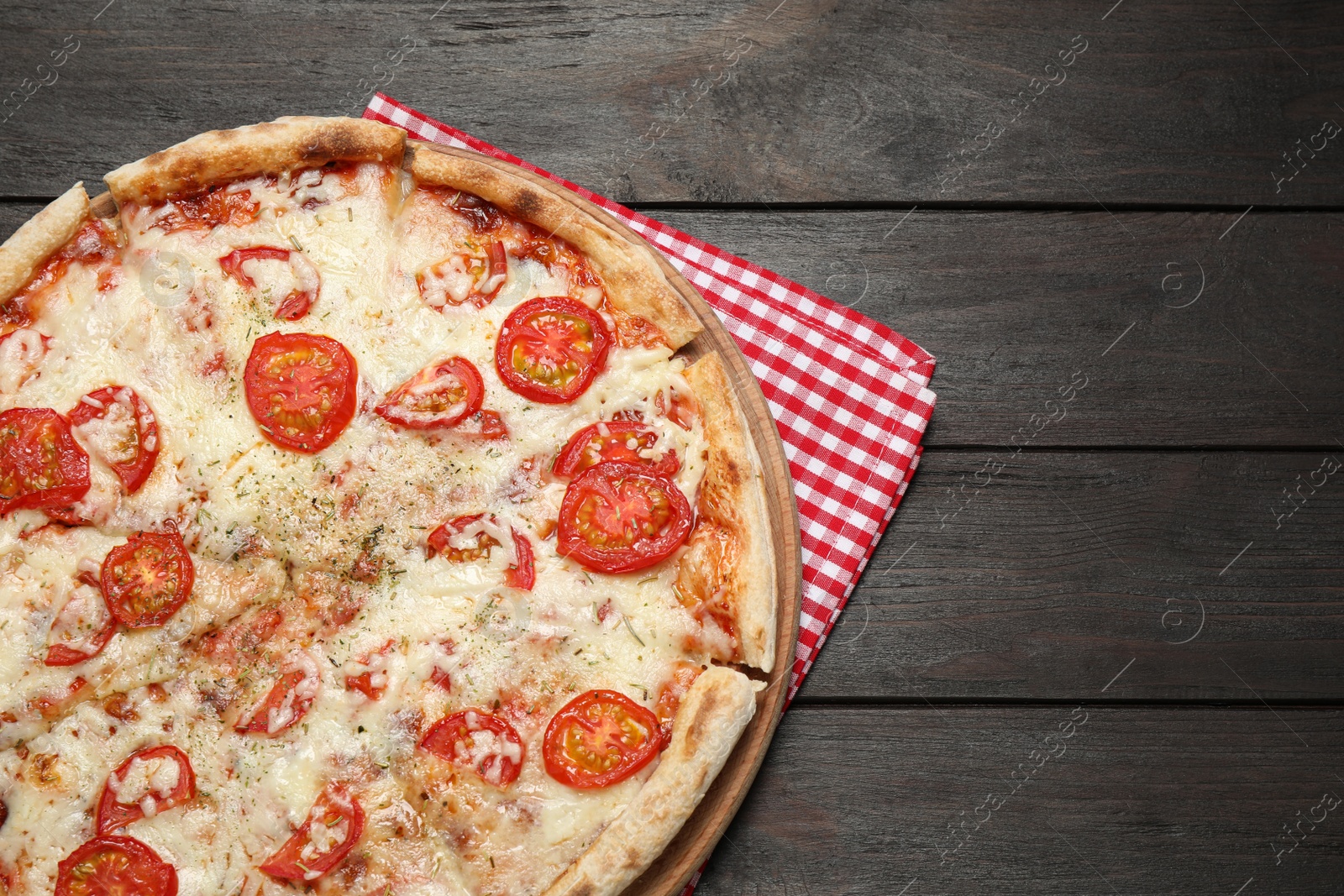 Photo of Delicious pizza Margherita on wooden table, top view