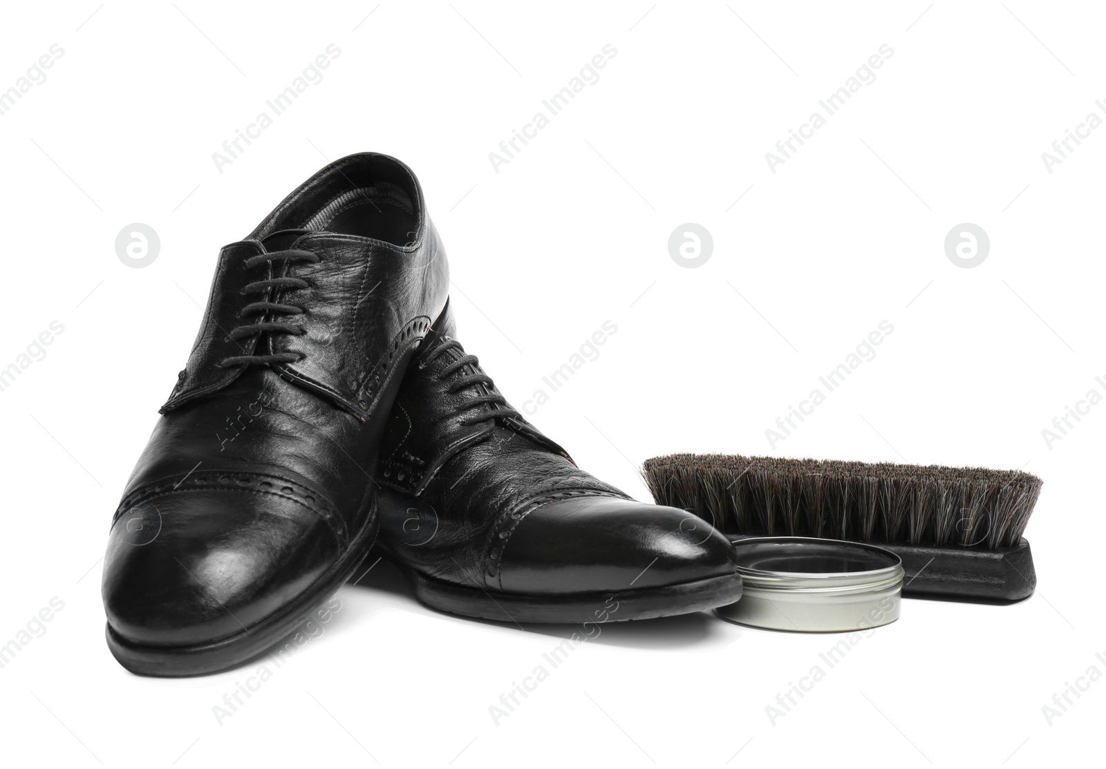 Photo of Stylish men's footwear and shoe care accessories on white background