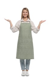 Beautiful young woman in clean apron on white background