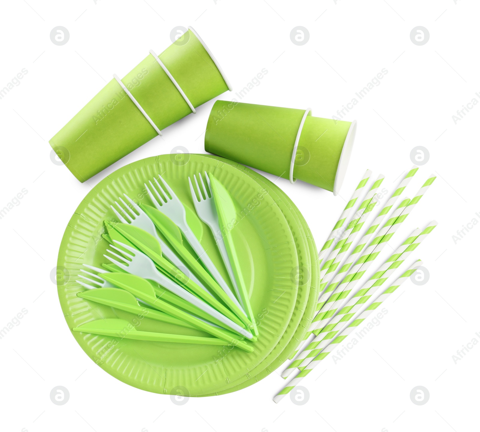 Photo of Set of bright disposable tableware on white background, top view