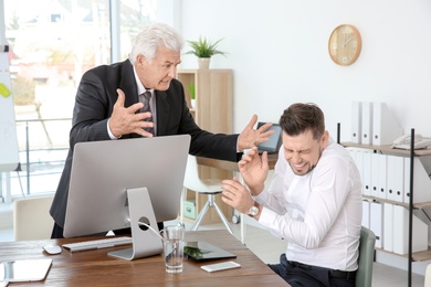 Office employees having argument at workplace