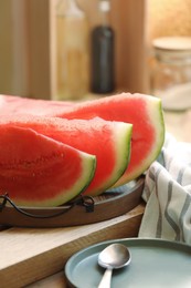 Photo of Slices of fresh juicy watermelon on wooden table