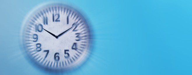 Image of Fleeting time concept. Clock on light blue background, motion effect. Banner design with space for text