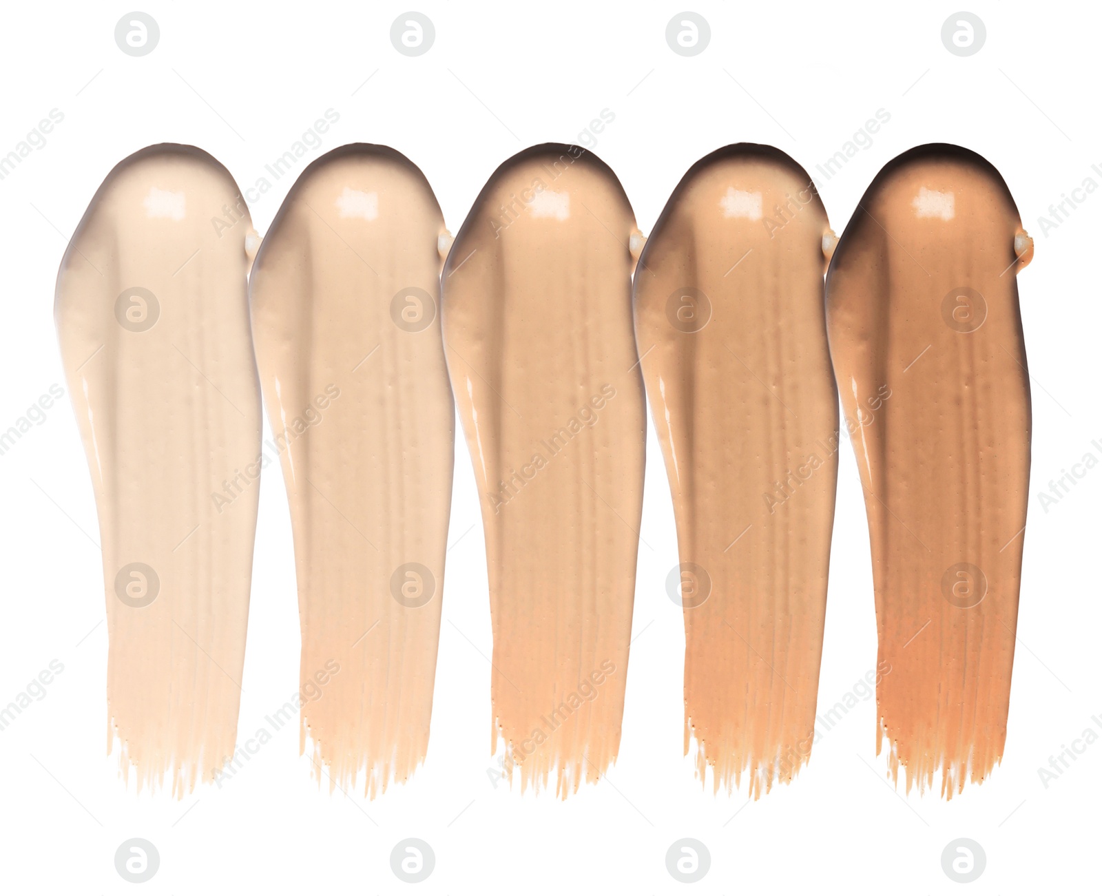 Image of Set of different foundation shades on white background, top view