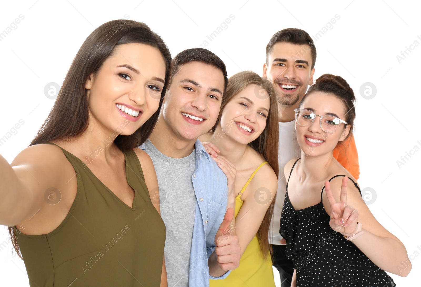 Photo of Young happy friends taking selfie against white background