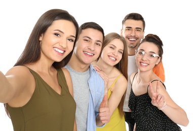 Young happy friends taking selfie against white background