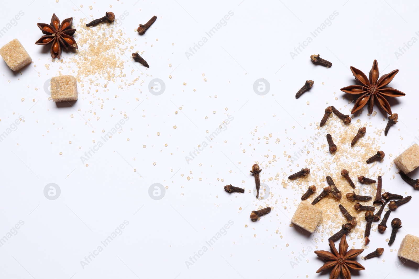 Photo of Different spices on white table, flat lay. Space for text