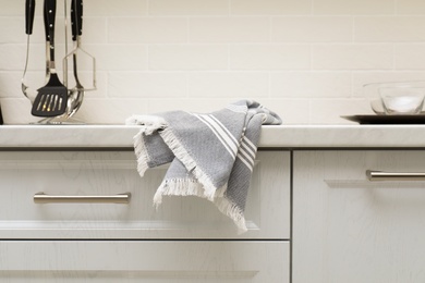 Clean kitchen towel on counter at home