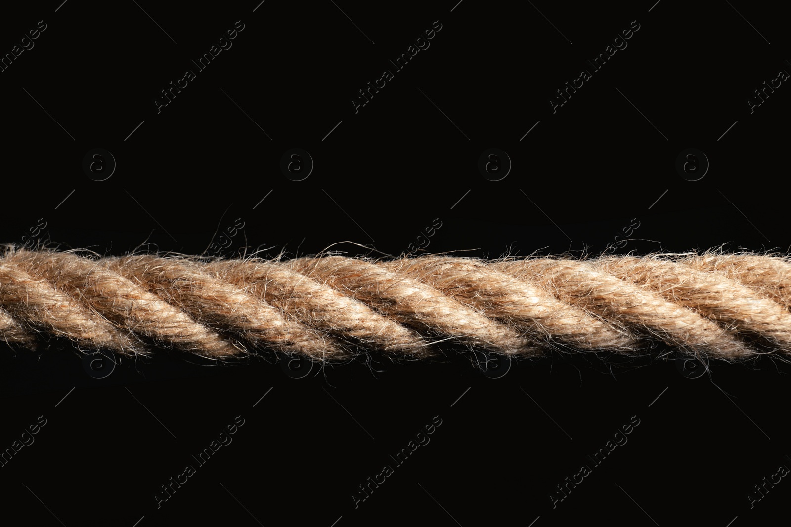 Photo of Strong nautical cotton rope on black background