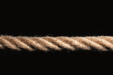 Strong nautical cotton rope on black background