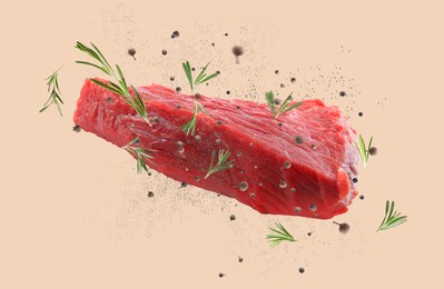 Image of Fresh raw meat and different spices flying on beige background