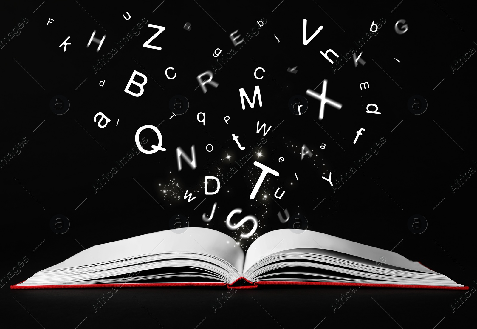 Image of Letters flying out from open book on black background