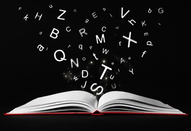 Image of Letters flying out from open book on black background