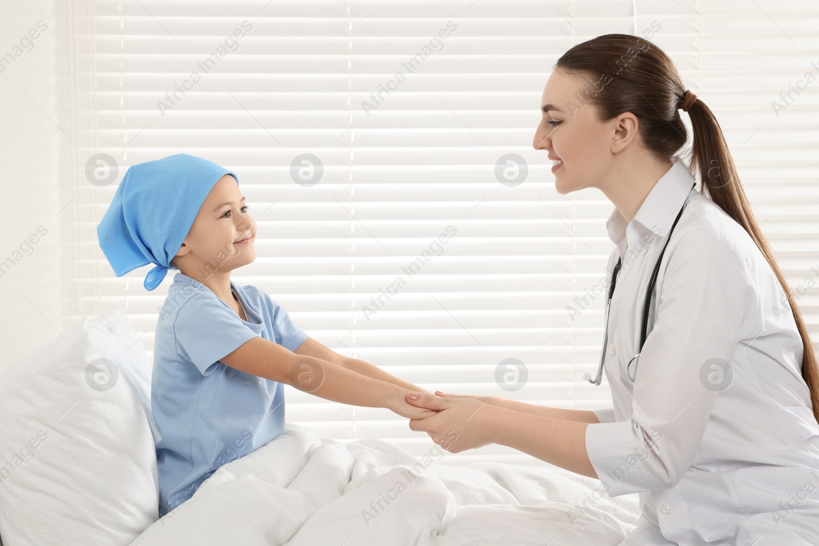 Photo of Childhood cancer. Doctor and little patient in hospital