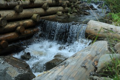 View of river flowing near rocks in forest